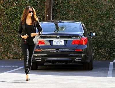 A picture of Eva Longoria near her BMW 750Li car.